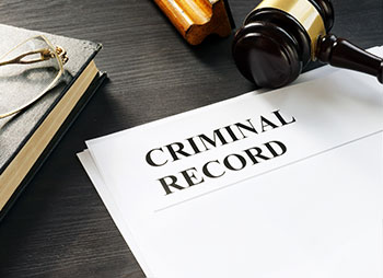 Criminal record form and a gavel - Coren Law Group P.C.