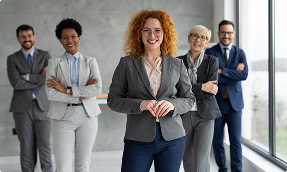 A group of business people standing in an office - Coren Law Group P.C.